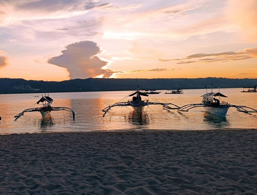 Boats by the sea during sunset on Alibijaban Island